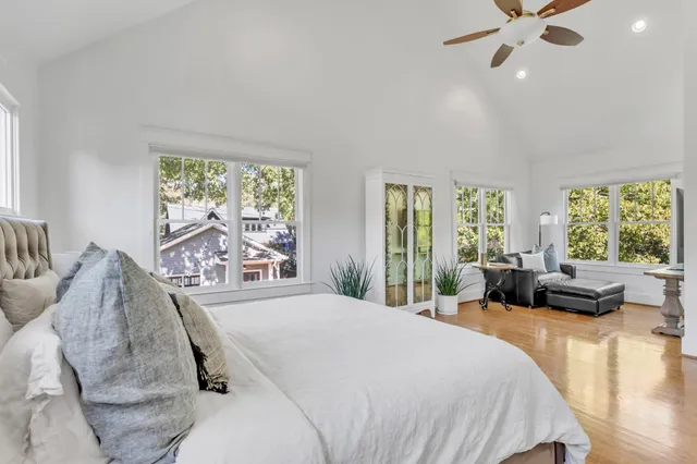 a spacious bathroom with a double vanity sink mirror and bathtub