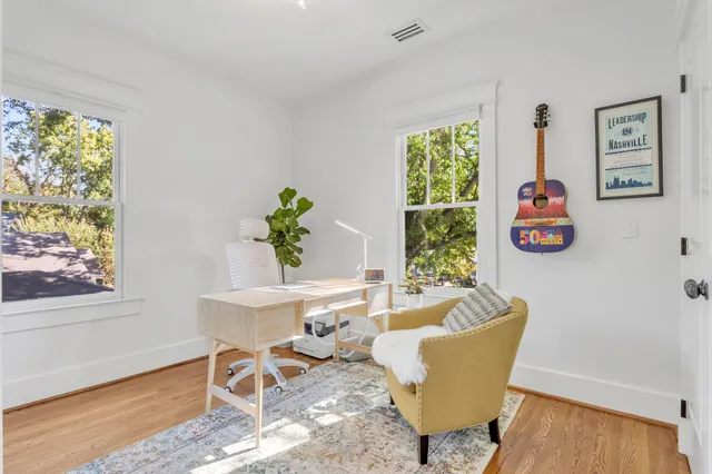 a bedroom with furniture and a window