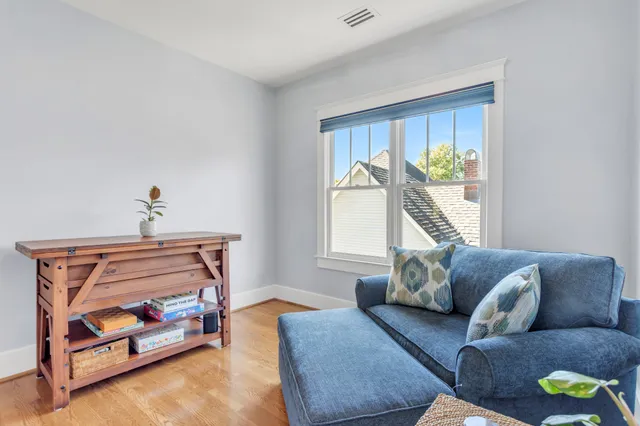 a view of a deck with furniture and a yard