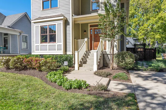 a front view of a house with garden