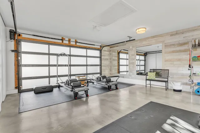 an aerial view of a house with a yard and garden