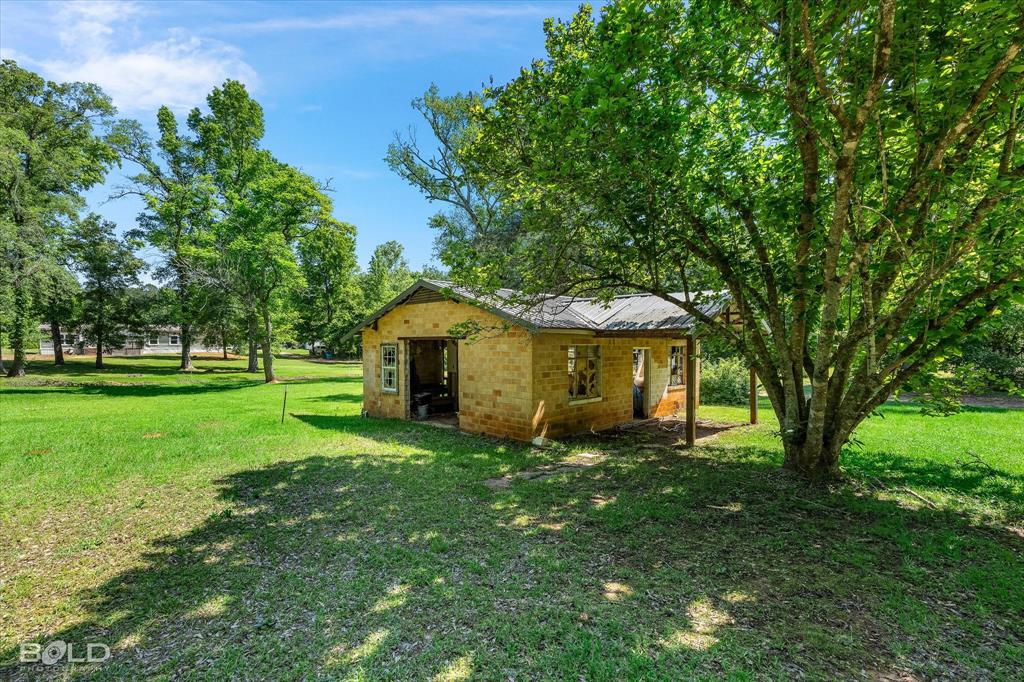 2153 Highway 2 Plain Dealing, LA 71064 - Photo 13 of 39 a view of a house with a yard