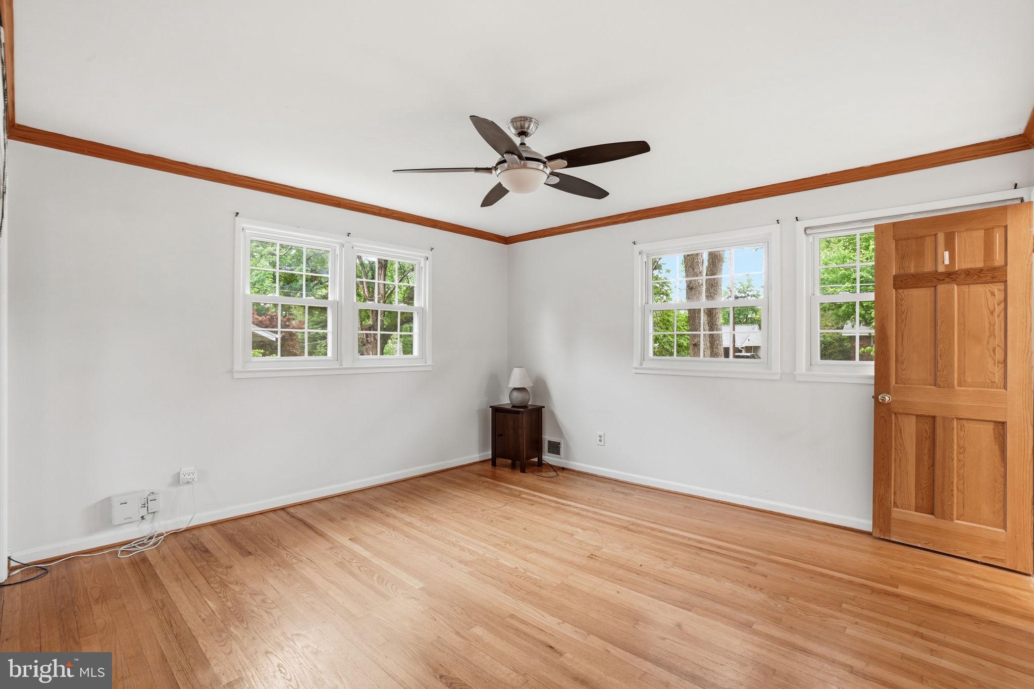 5304 Pillow Lane Springfield, VA 22151 - Photo 16 of 32 a view of an empty room with wooden floor and a window