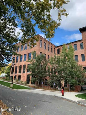 a front view of a building with street view