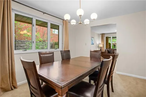 a view of a dining room with furniture window and outside view