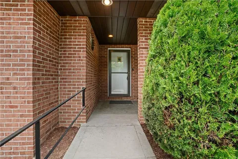 a view of a pathway both side of house