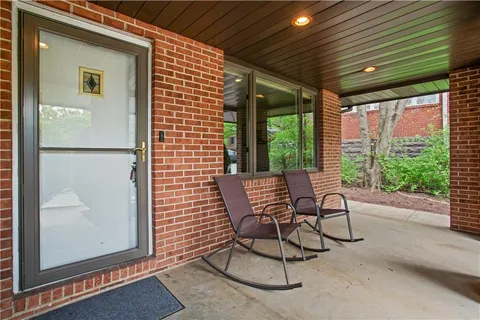 a view of a chairs and table in a patio