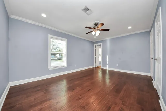 a bathroom with a granite countertop sink a mirror a bathtub and shower