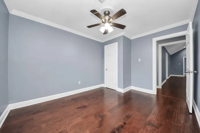 a bathroom with a granite countertop sink a toilet and a mirror