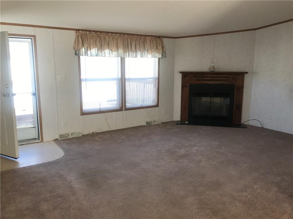 623 Deana Way Rochester, PA 15074 - Photo 3 of 19 Living room features gas fireplace.