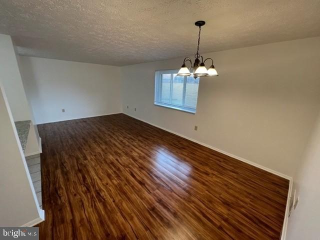 830 Heather Ridge Drive, Unit 22C Frederick, MD 21702 - Photo 8 of 22 Spacious room with warm wood flooring.