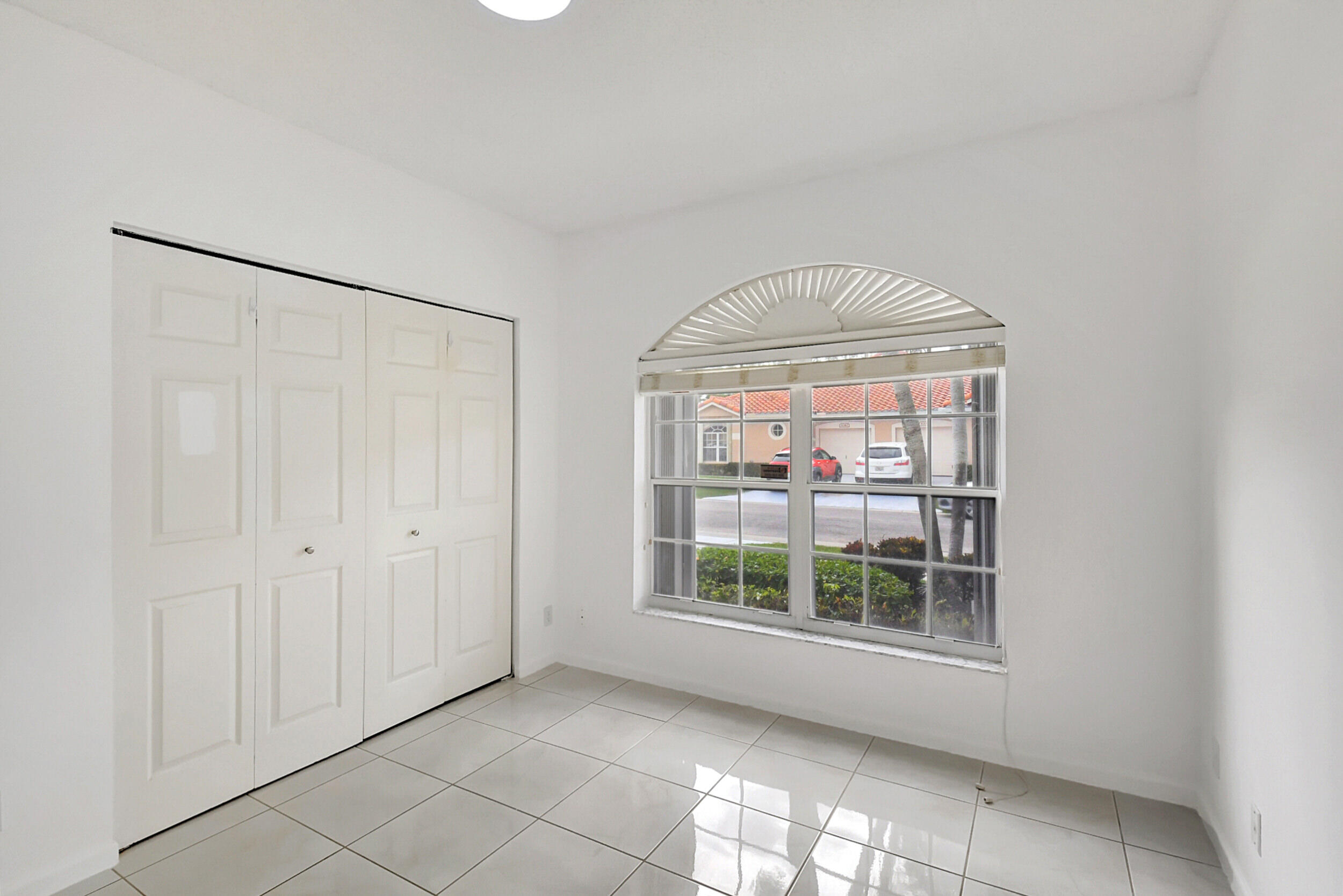 6340 Long Key Lane Boynton Beach, FL 33472 - Photo 16 of 29 a view of empty room with windows