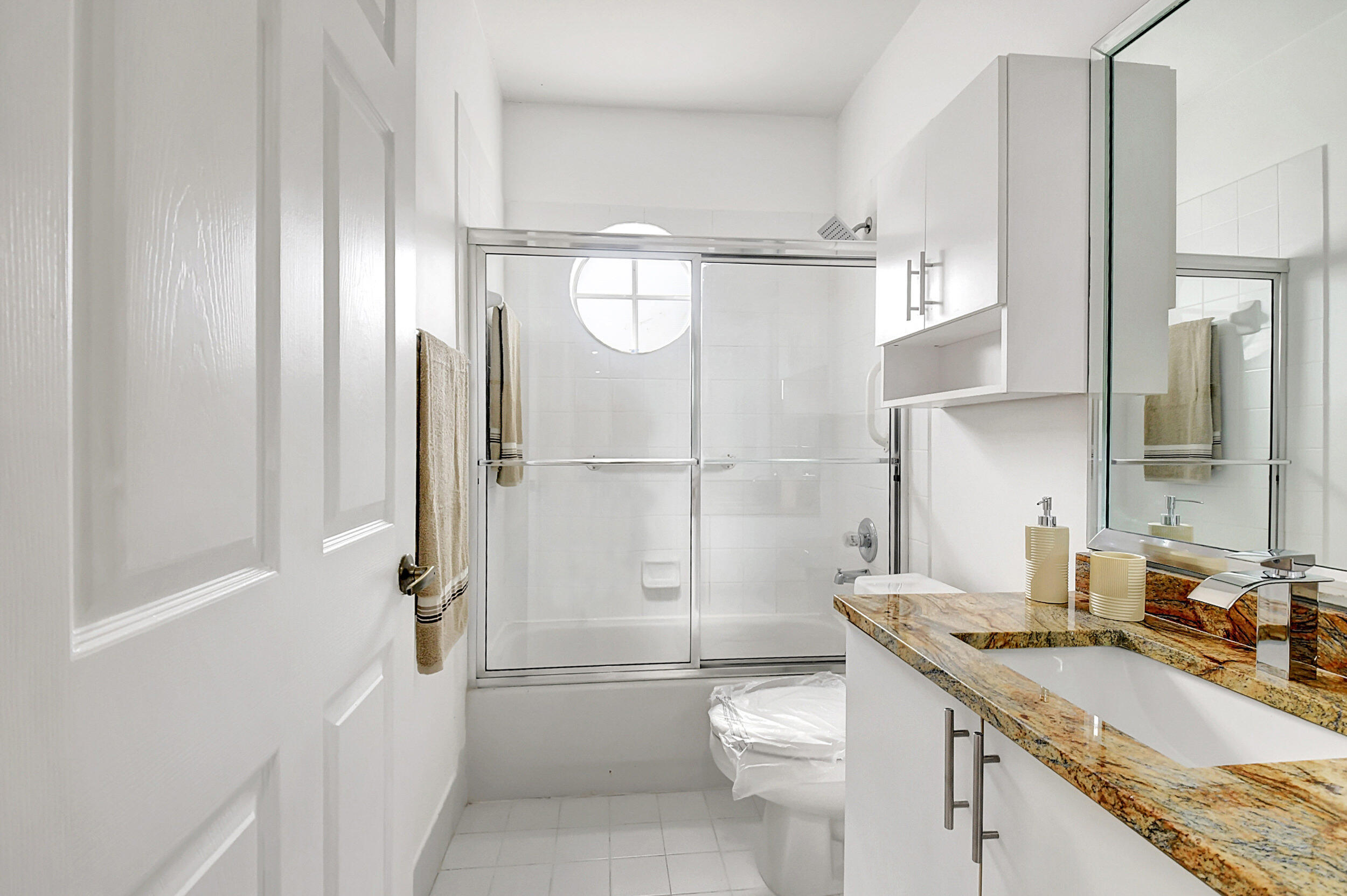 6340 Long Key Lane Boynton Beach, FL 33472 - Photo 17 of 29 a bathroom with a granite countertop sink toilet and shower