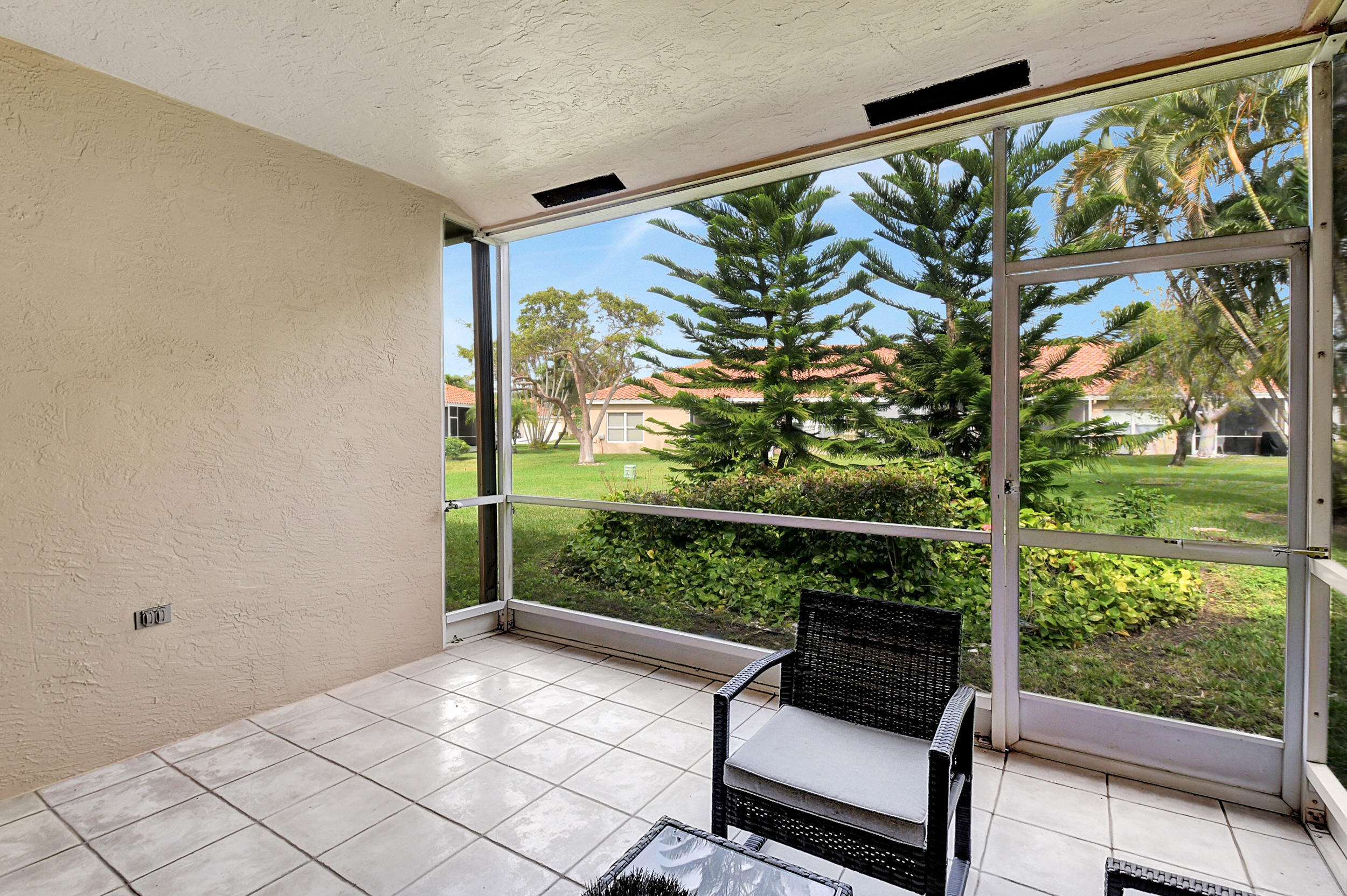 6340 Long Key Lane Boynton Beach, FL 33472 - Photo 18 of 29 a view of a two chair in the balcony