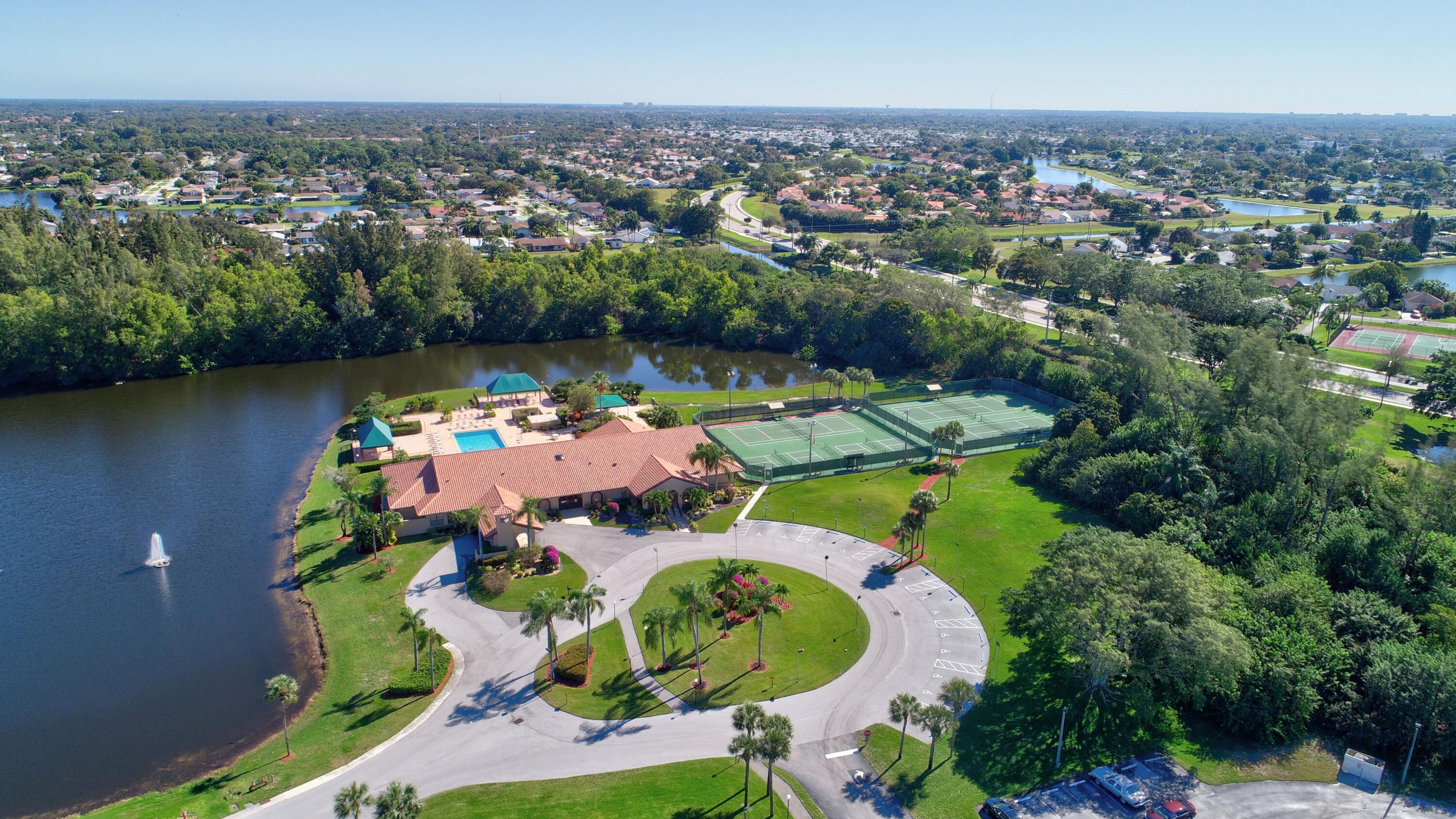 6340 Long Key Lane Boynton Beach, FL 33472 - Photo 24 of 29 an aerial view of a house with a lake view