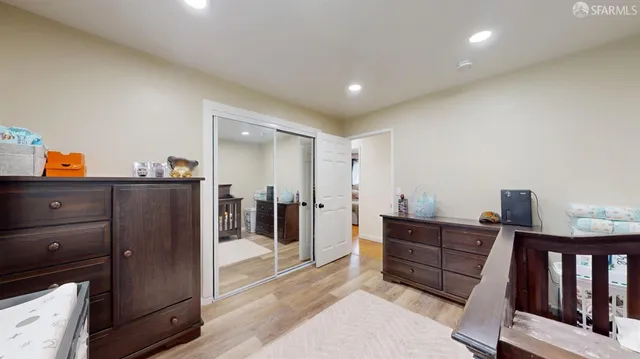 a bedroom with furniture and a window