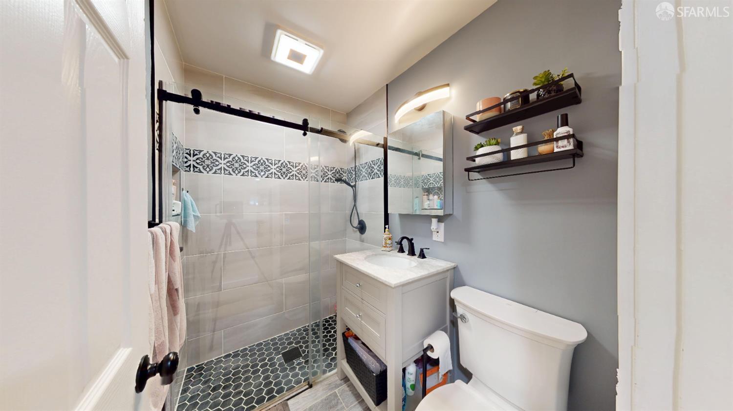 1155 Crespi Drive Pacifica, CA 94044 - Photo 16 of 29 bathroom with vanity and a curbless shower stall