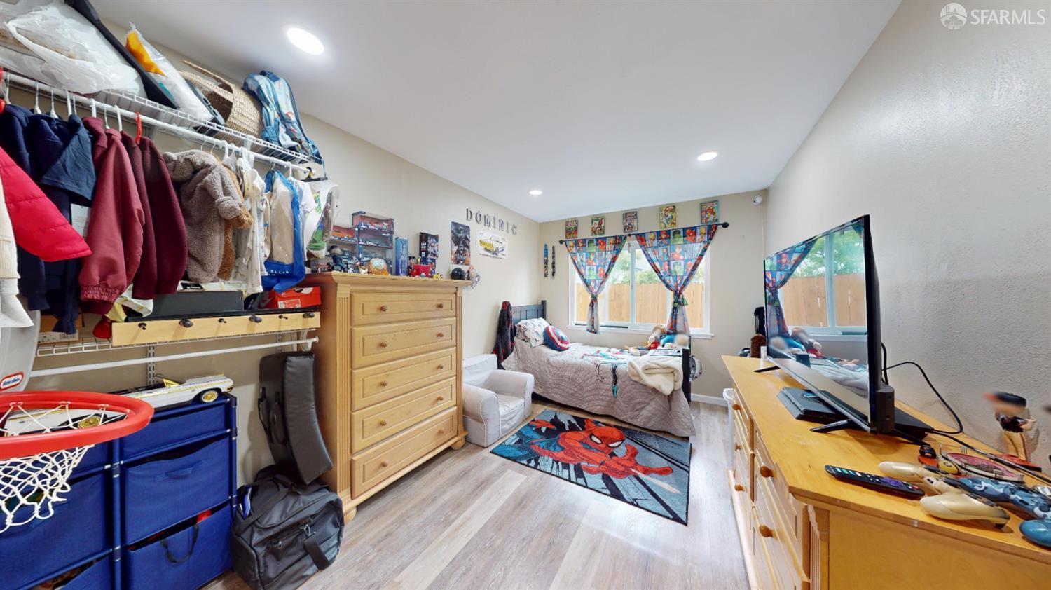 1155 Crespi Drive Pacifica, CA 94044 - Photo 17 of 29 bedroom with light wood-style floors and recessed lighting