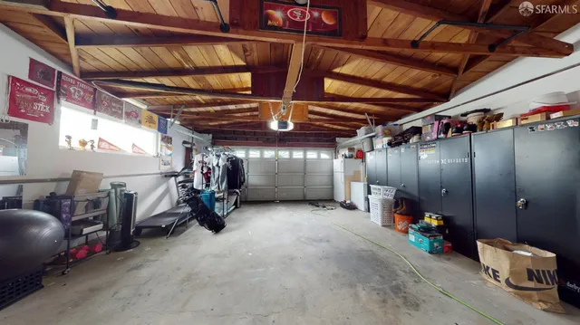 an aerial view of a house with garden space and street view