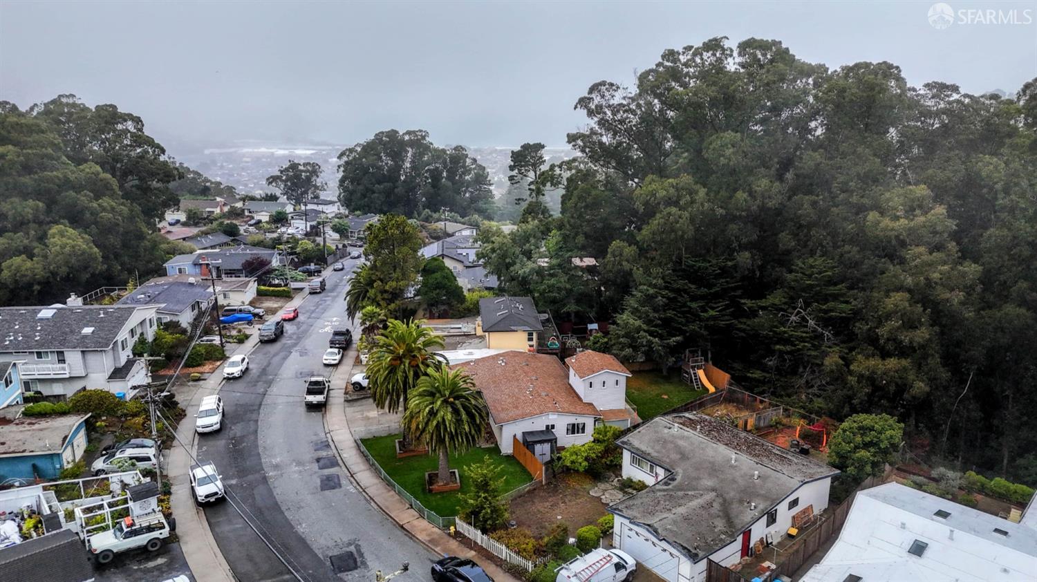 1155 Crespi Drive Pacifica, CA 94044 - Photo 29 of 29 aerial view of 1155 Crespi Drive with a fog covered view of the Pacific Ocean (Pacifica State Beach)