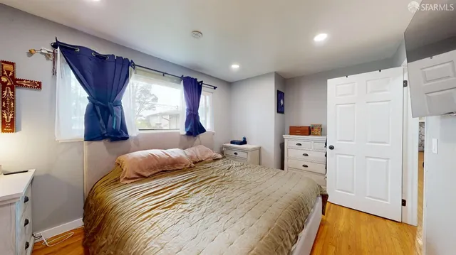 a spacious bathroom with a tub sink and mirror