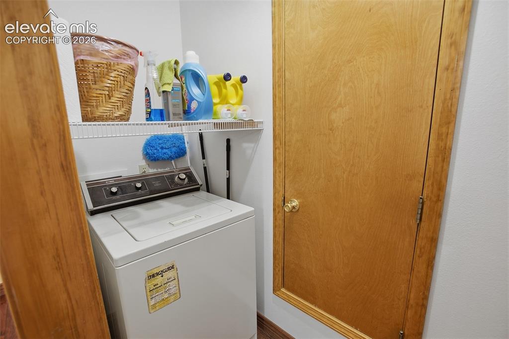 877 North Mountain Estates Road Florissant, CO 80816 - Photo 18 of 23 a utility room with dryer and washer