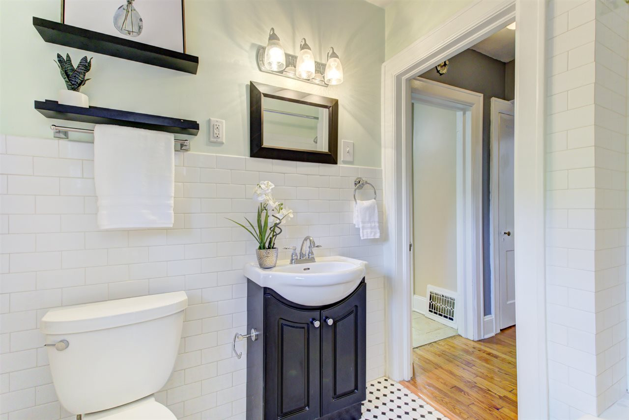 413 Dixie Trail Raleigh, NC 27607 - Photo 16 of 30 Updated master bathroom with striking tiled wall Master Bathroom