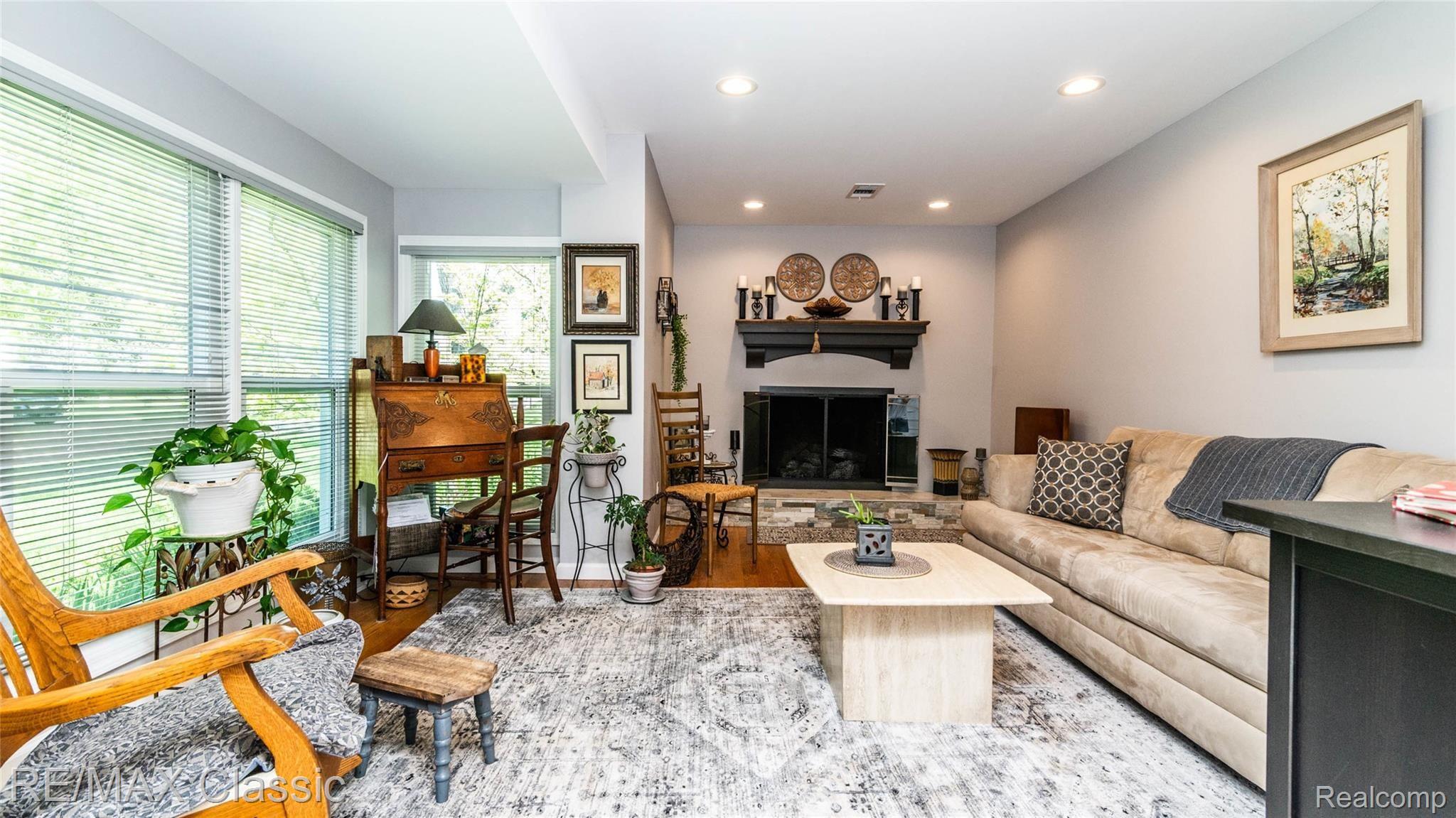 living room wood flooring and new remote gas fireplace