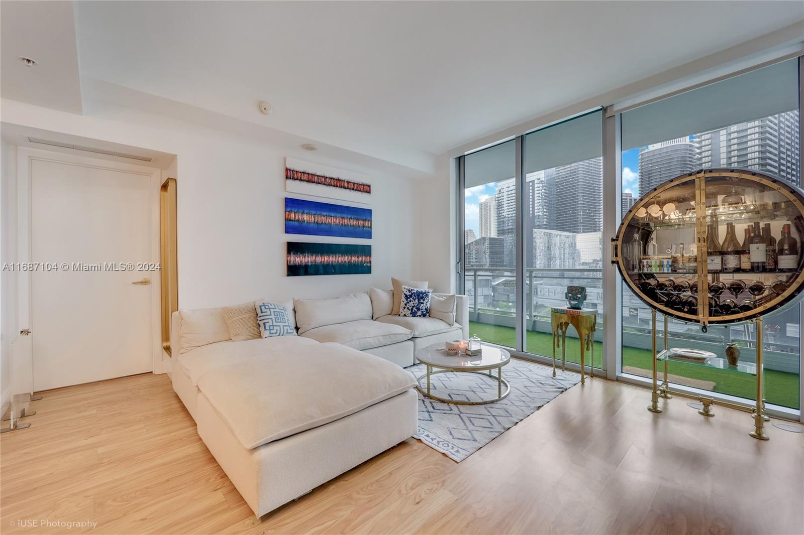 92 Southwest 3rd Street, Unit 1604 Miami, FL 33130 - Photo 13 of 18 a living room with furniture and a large window