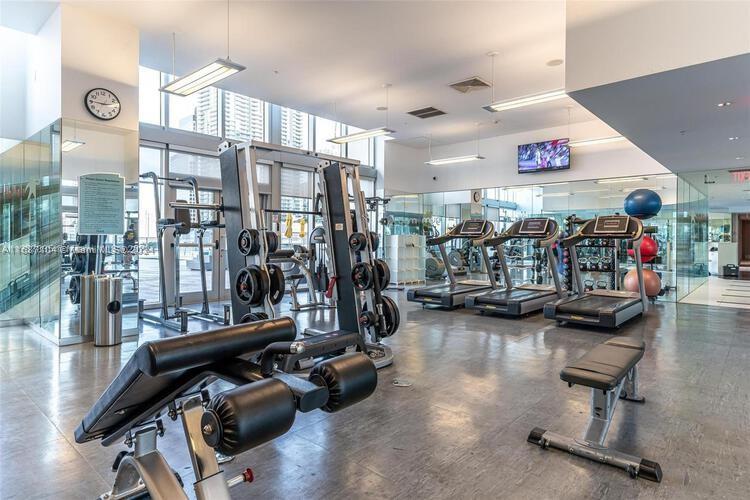 92 Southwest 3rd Street, Unit 1604 Miami, FL 33130 - Photo 18 of 18 a view of a room with gym equipment
