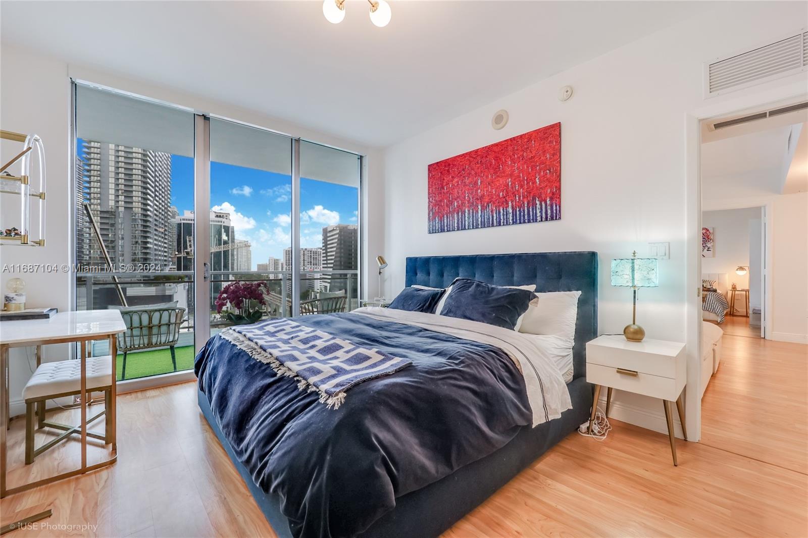 92 Southwest 3rd Street, Unit 1604 Miami, FL 33130 - Photo 5 of 18 a bed sitting in a bedroom next to a window