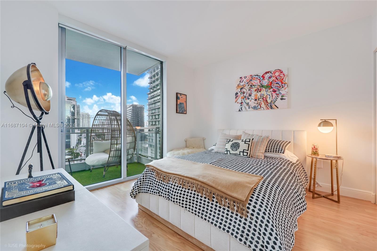 92 Southwest 3rd Street, Unit 1604 Miami, FL 33130 - Photo 8 of 18 a bedroom with a bed and a flat tv screen