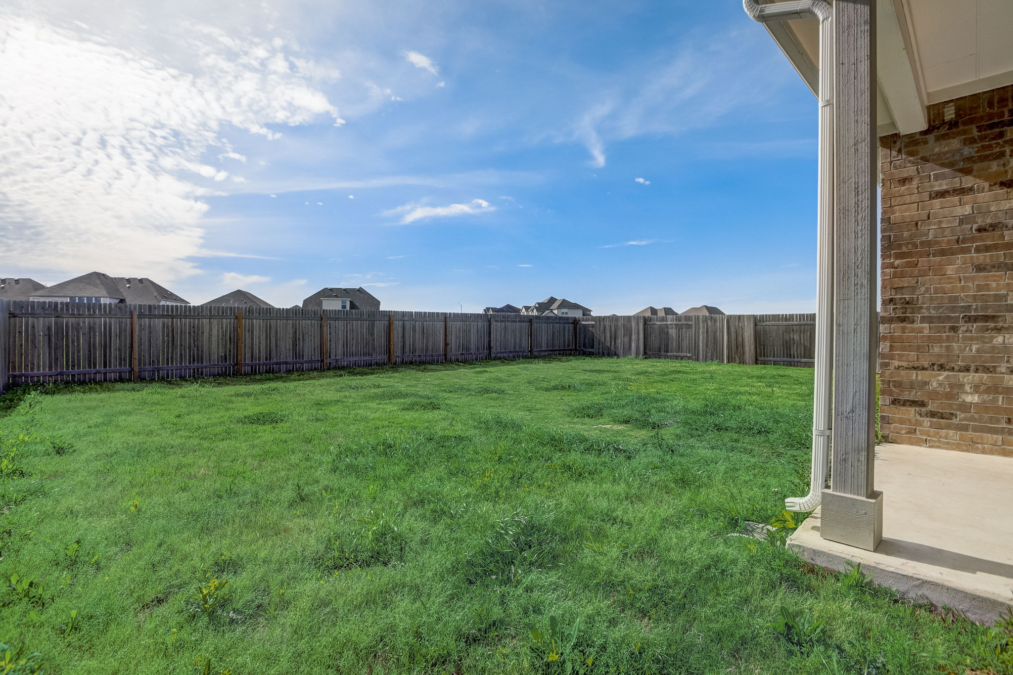 308 Monteforte Road Hutto, TX 78634 - Photo 30 of 32 a view of a house with backyard and backyard