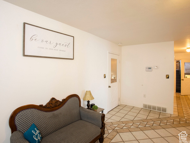 588 Raspberry Patch Road Garden City, UT 84028 - Photo 43 of 74 Sitting room with light tile patterned floors