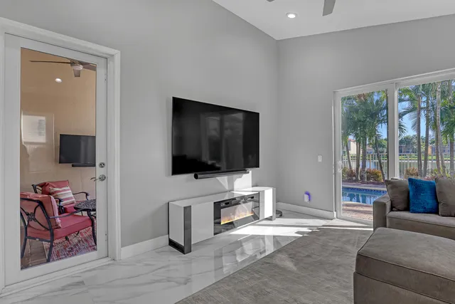 a view of walk in closet with clothes