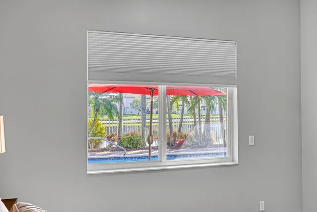a view of a livingroom with furniture and a flat screen tv