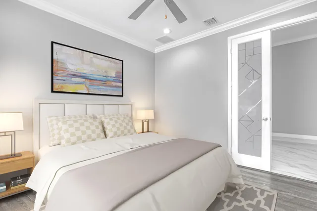 a living room with furniture a flat screen tv and a large window