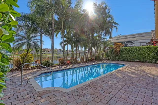 a view of a swimming pool with a table and chairs