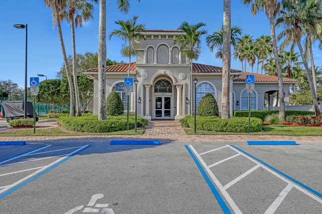 an aerial view of residential houses with outdoor space and lake view