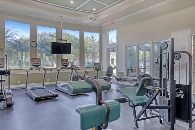 an aerial view of residential houses with outdoor space and lake view