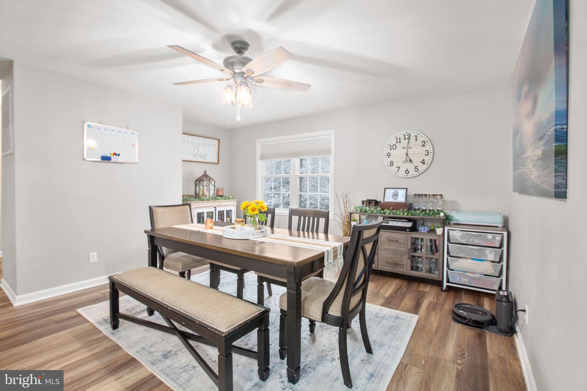 114 Saylers Creek Road Locust Grove, VA 22508 - Photo 15 of 32 a view of a dining room with furniture and wooden floor