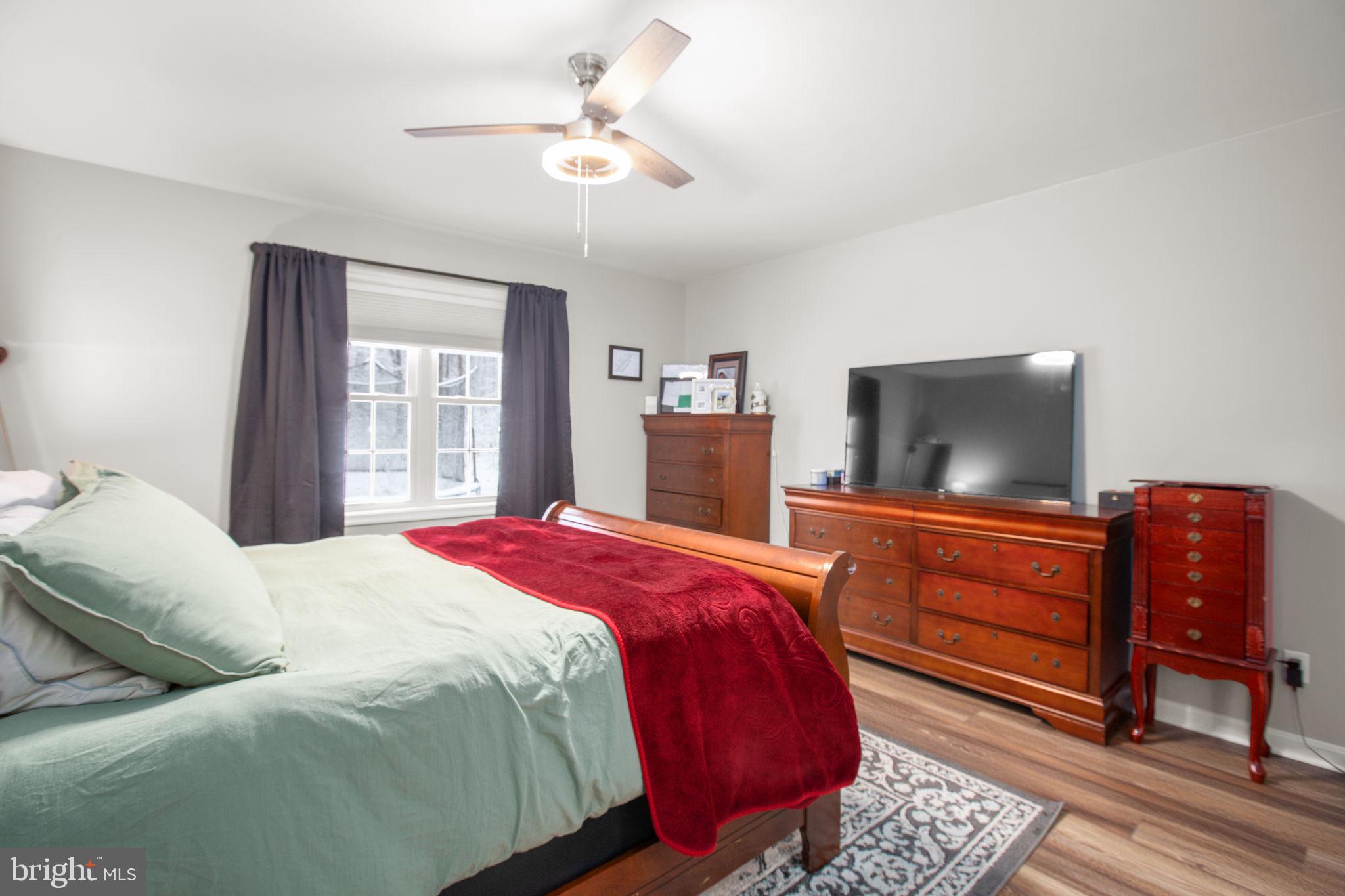 114 Saylers Creek Road Locust Grove, VA 22508 - Photo 17 of 32 a bedroom with a bed and a dresser in it