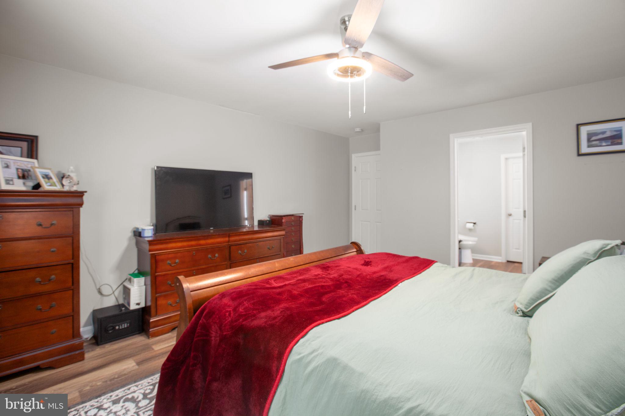 114 Saylers Creek Road Locust Grove, VA 22508 - Photo 18 of 32 a bedroom with a bed and a flat screen tv