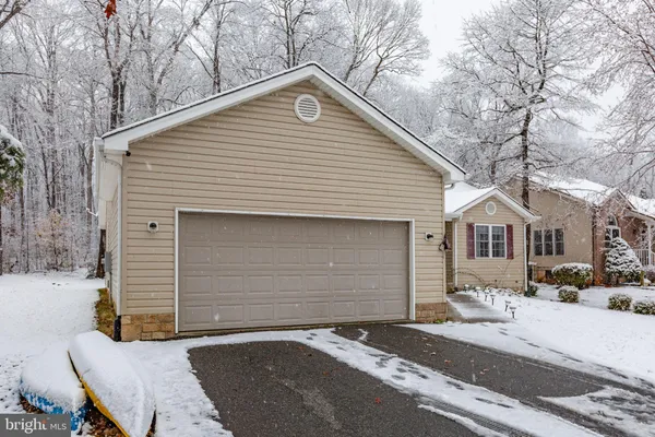 a front view of a house with a garage