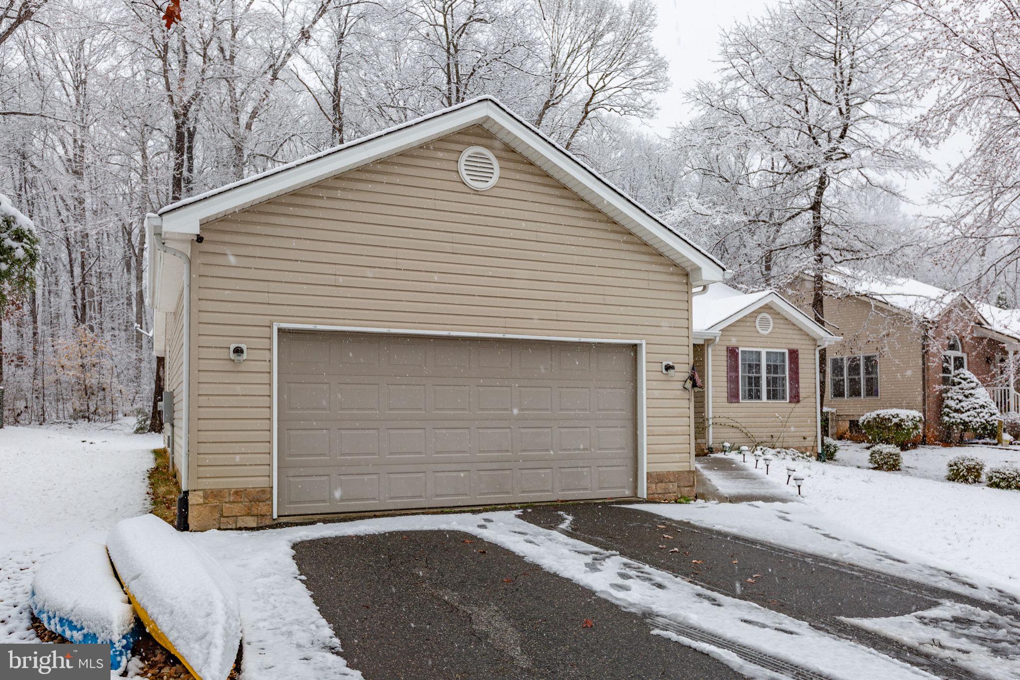 114 Saylers Creek Road Locust Grove, VA 22508 - Photo 2 of 32 a front view of a house with a garage