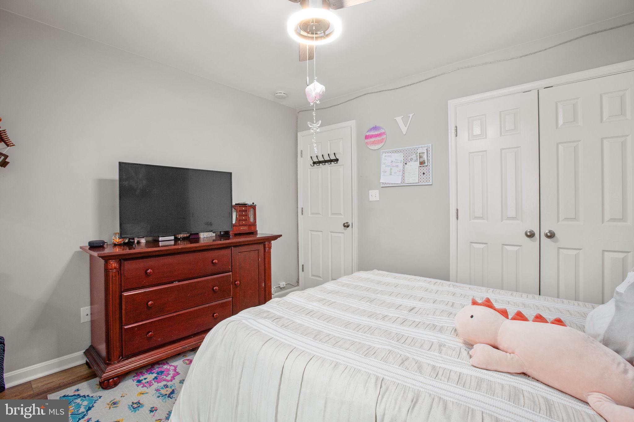 114 Saylers Creek Road Locust Grove, VA 22508 - Photo 23 of 32 a bedroom with a bed and a flat screen tv