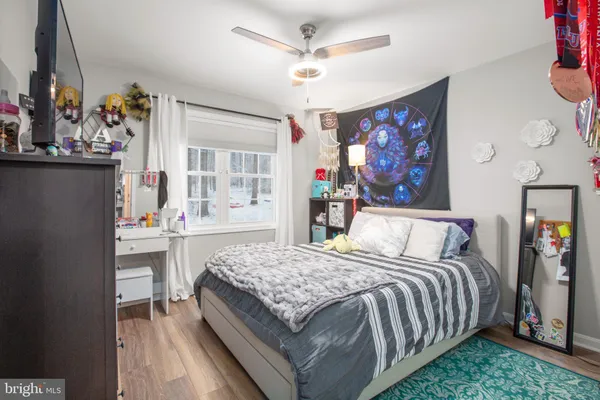 a bedroom with a bed and flat screen tv