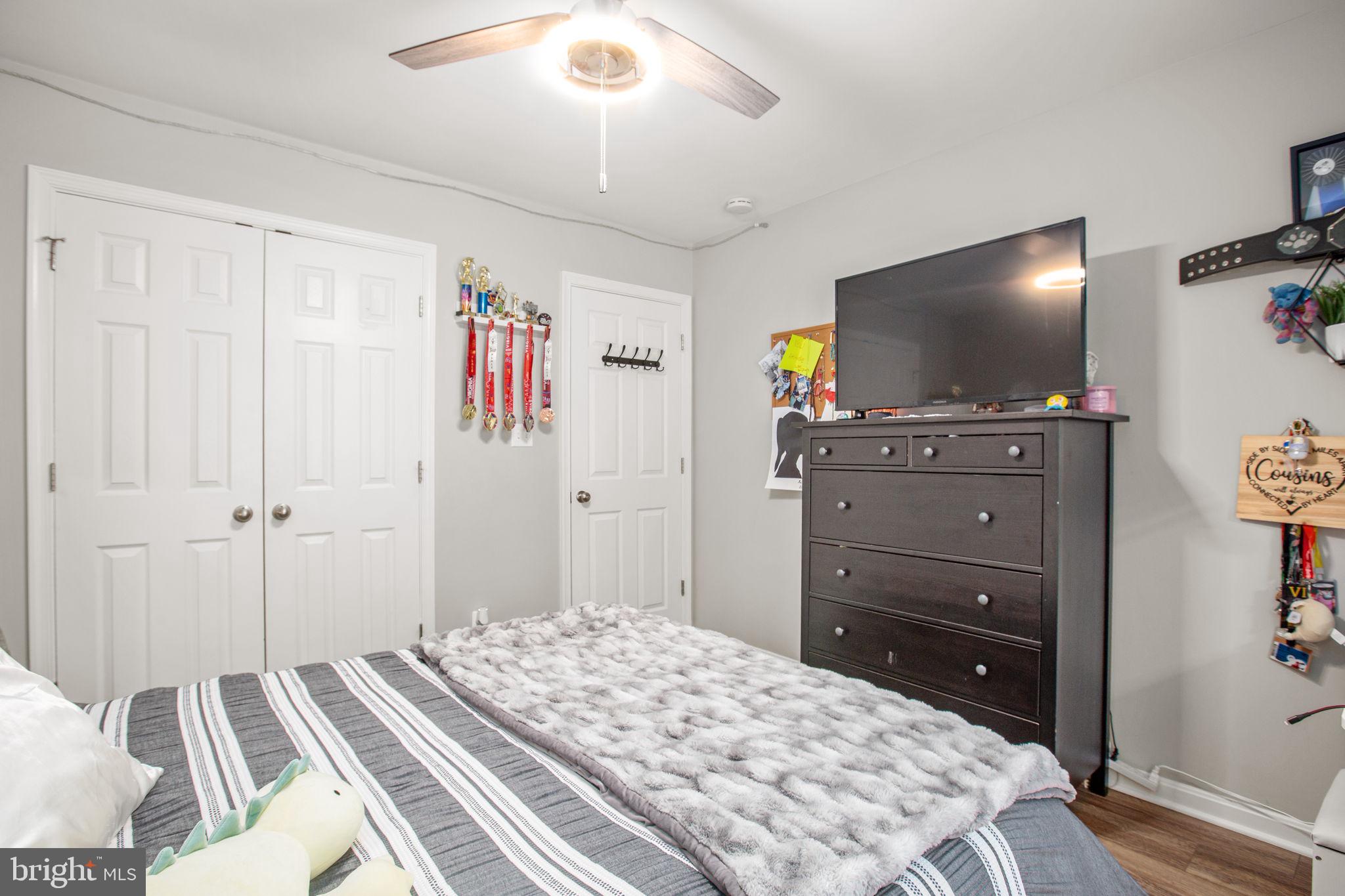 114 Saylers Creek Road Locust Grove, VA 22508 - Photo 26 of 32 a bedroom with a bed and flat screen tv