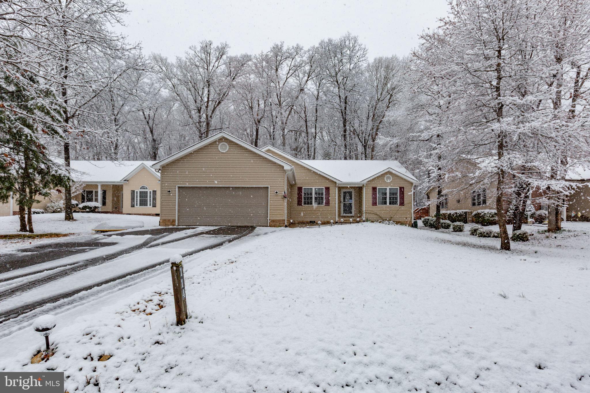 114 Saylers Creek Road Locust Grove, VA 22508 - Photo 4 of 32 a front view of a house with a yard and garage
