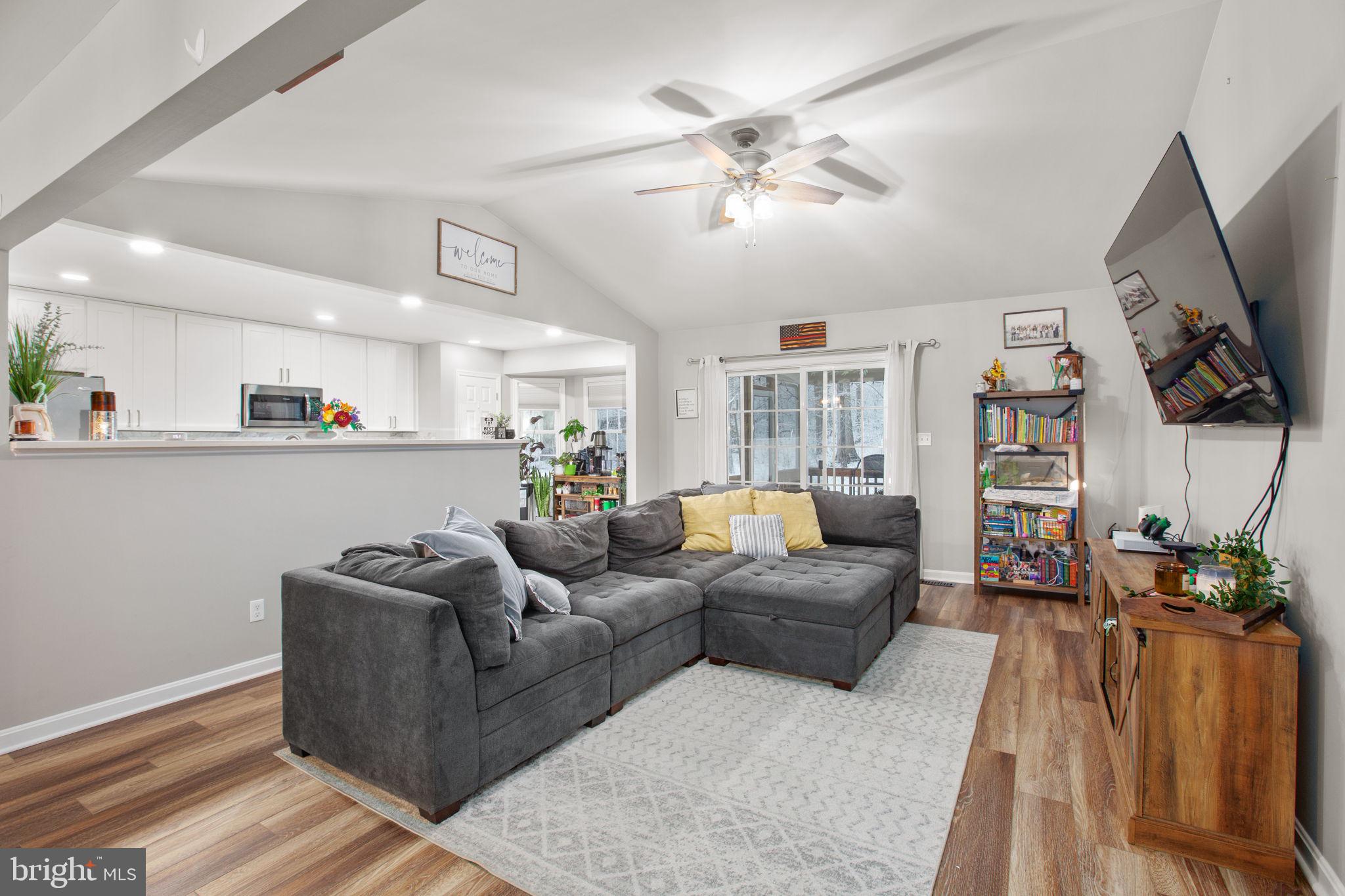 114 Saylers Creek Road Locust Grove, VA 22508 - Photo 6 of 32 a living room with furniture and a flat screen tv